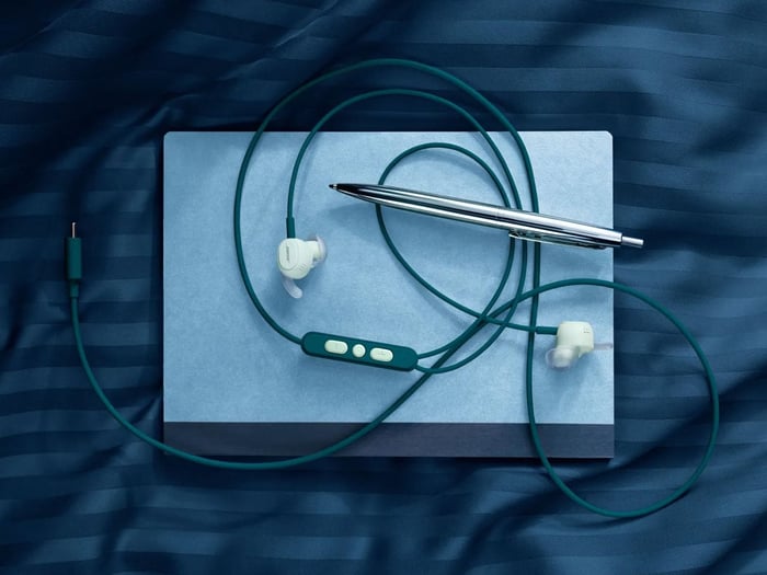 Bose wired earbuds shown with their protective case