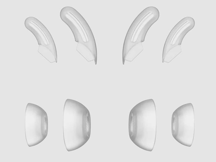 Bose earbuds shown from the side with the in-line control system