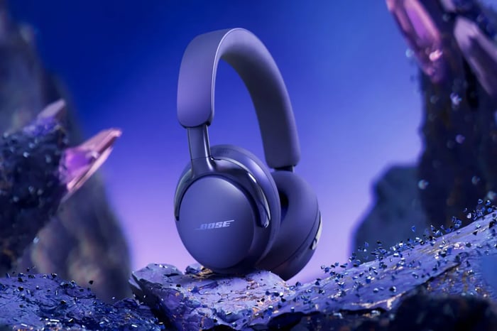 Bose QuietComfort Ultra headphones showing polished metal bands and plush cushions