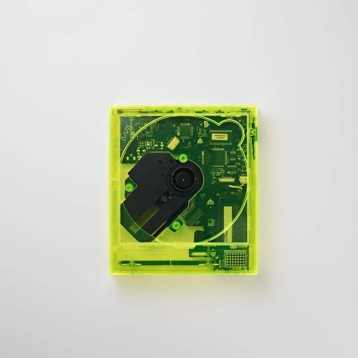Close-up showcasing km5 and bPr BEAMS collaboration on the neon yellow CD player