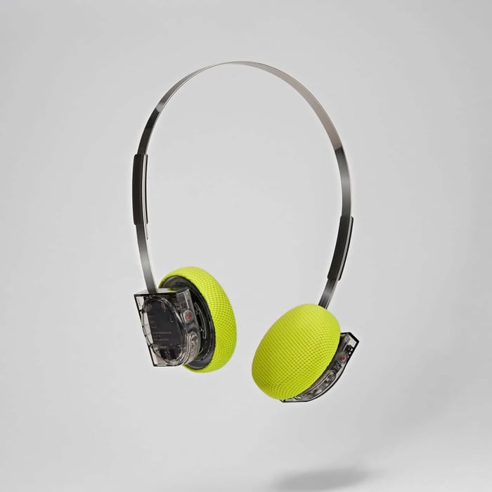 Hp1 Clear headphones with transparent housing and vibrant yellow ear pads