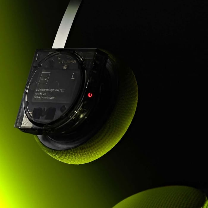 Close-up view of neon yellow CD player’s illuminated circuit board and wiring