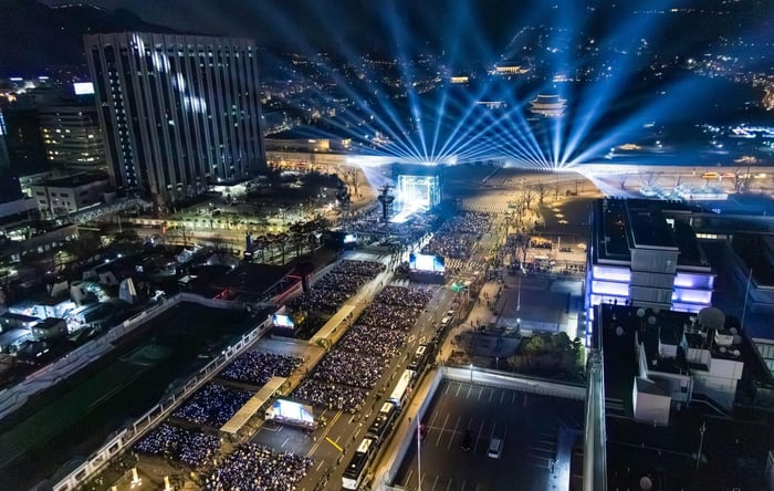RM performing cautiously with a black ankle boot.