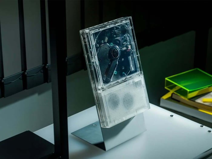 ClearFrame CD player with a transparent body and album artwork