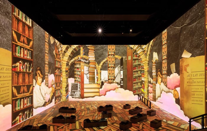 The cube-shaped room projects Bowie’s performances all around you