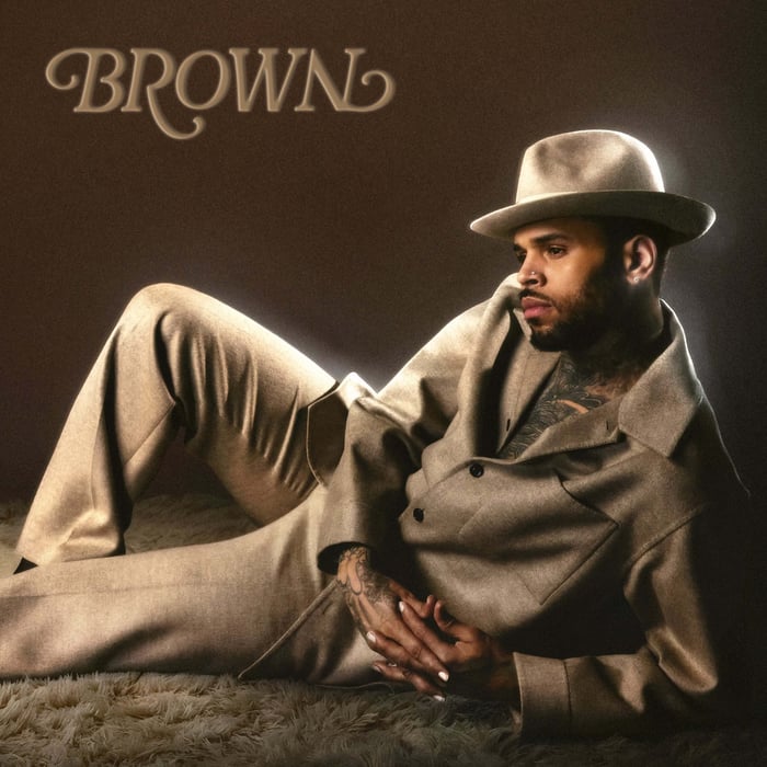Chris Brown BROWN album cover—reclining in a tan suit and fedora