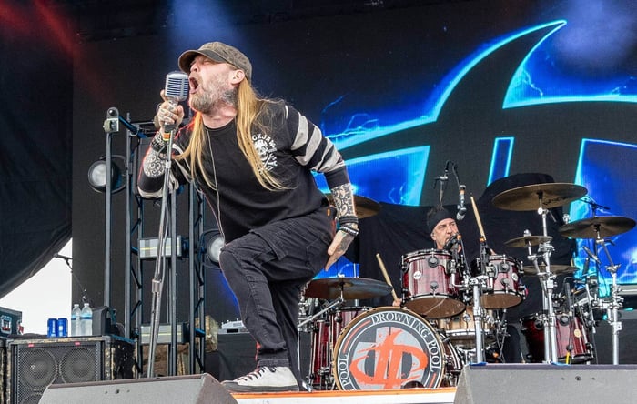 Drowning Pool performing live on stage
