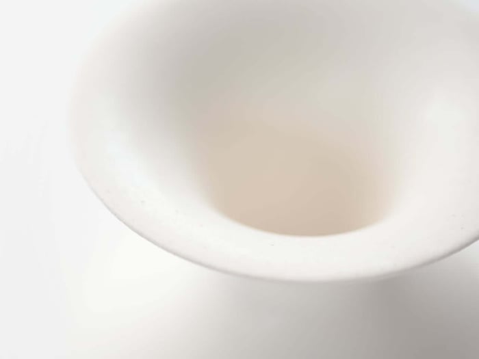 Close-up of glazed ceramic surface reflecting light