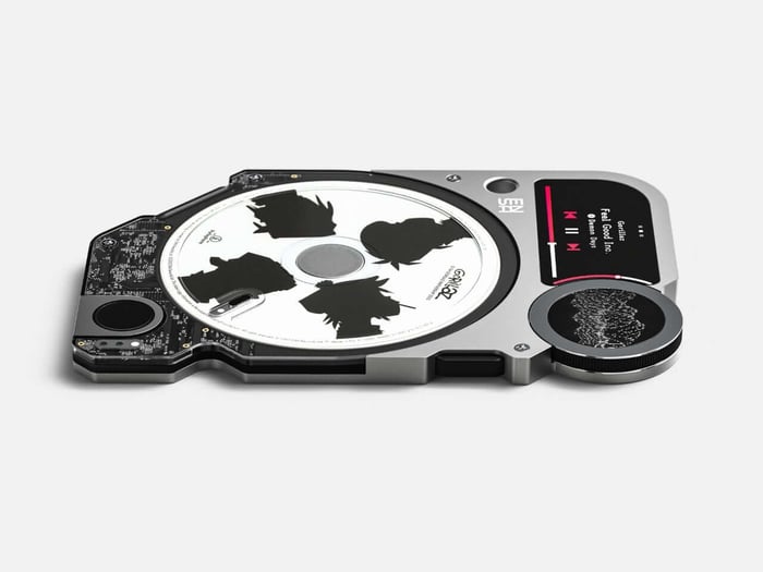 The ENSA P1 player rests among a curated collection of cartridges