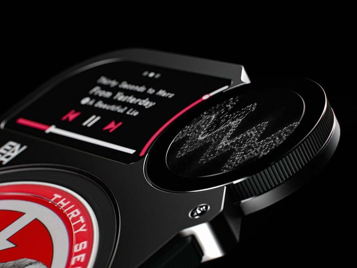 The player alongside multiple cartridges, showcasing a new music collection format