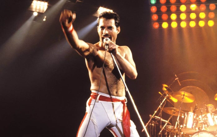 Freddie Mercury on stage, captivating the crowd with Queen