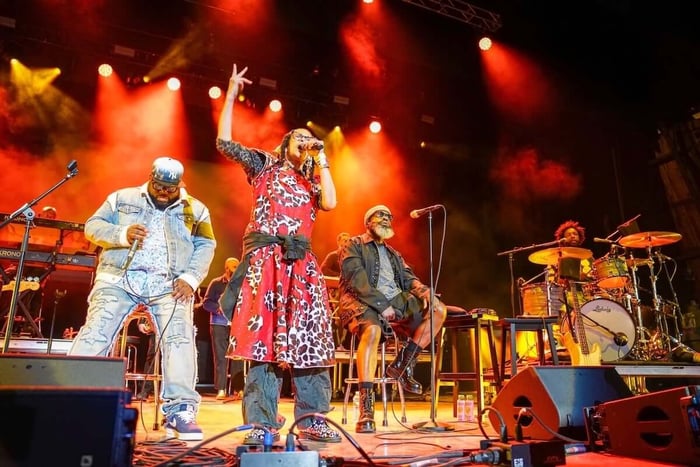 Ursula Rucker (second from left) and the Roots perform onstage during the Roots Picnic at The Mann at Fairmount Park on June 1, 2025, in Philadelphia, Pennsylvania.