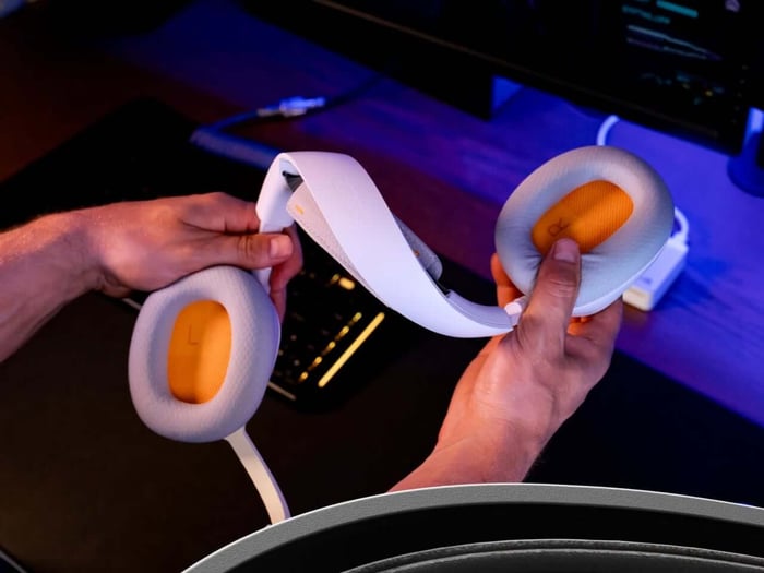 Headset resting on desk with charging base