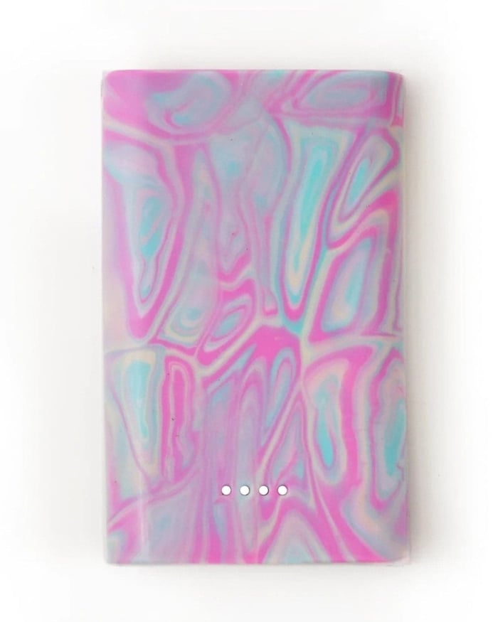 Close-up of a handmade marbled Gomi Barbie tech product