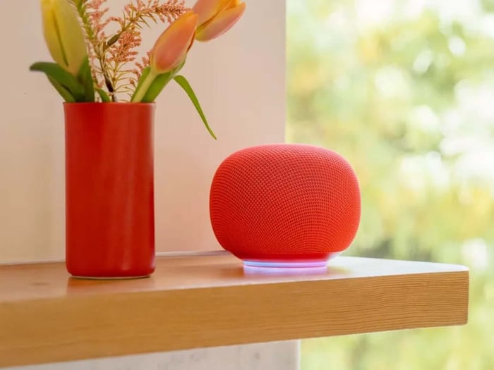 Google Home Speaker resting on a shelf blending with home decor