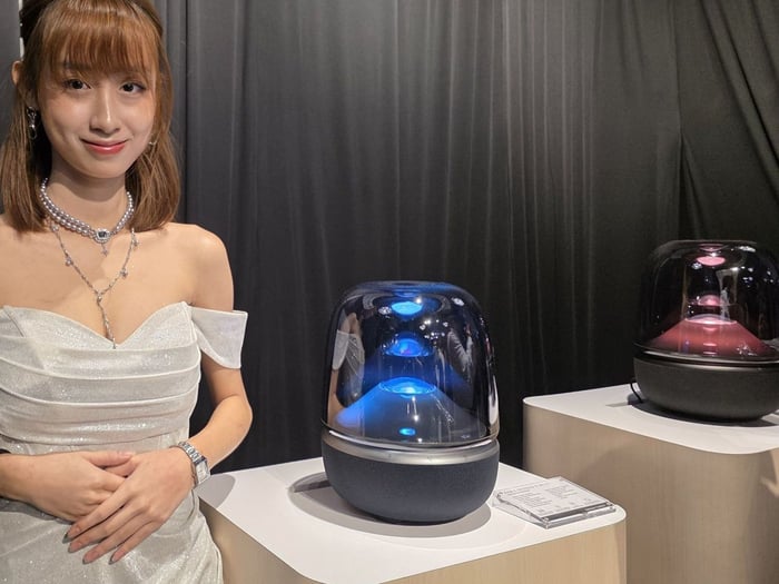 Aura Studio 5 Bluetooth speaker glowing on a nightstand