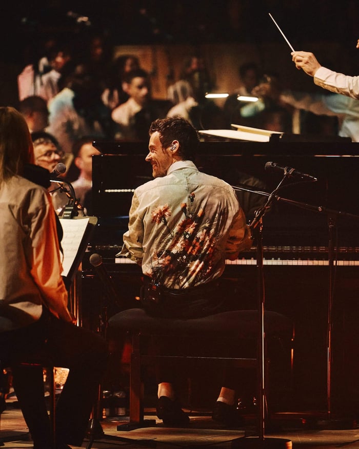 Harry Styles performing with Jules Buckley Orchestra