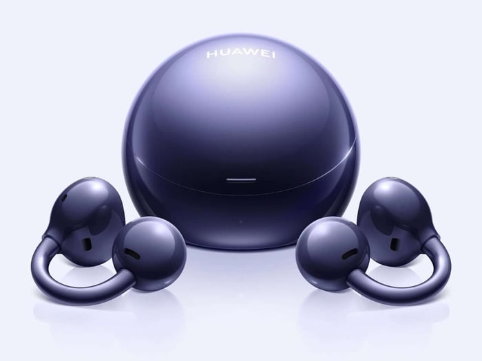 The spherical case glimmers like a compact mirror.