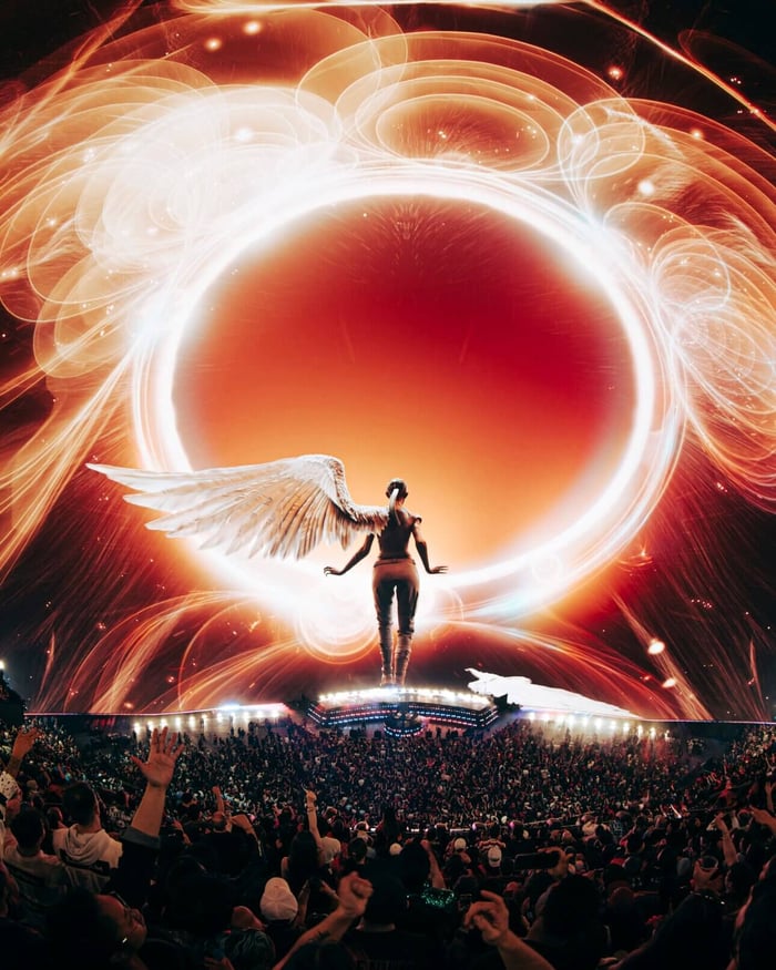 ILLENIUM performing in a swirl of colorful lights