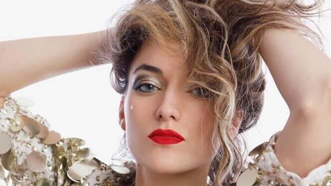 LA Laura Paris in vibrant stage lighting