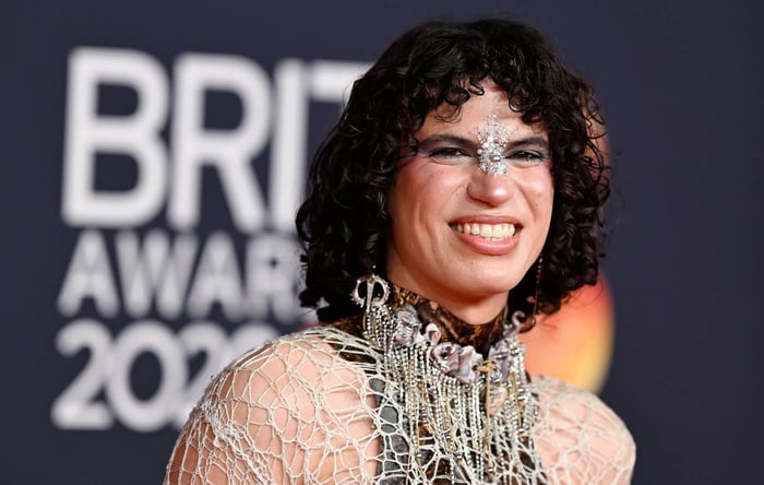 Jacob Alon holding Palestinian scarf at 2026 BRIT Awards