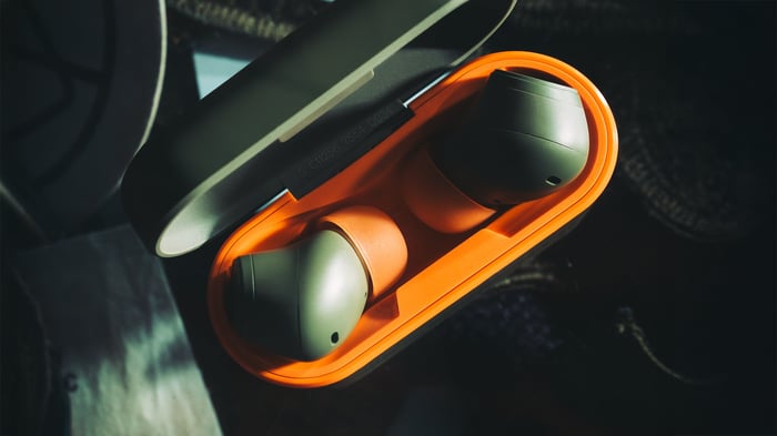 Cambridge Audio Maharishi Melomania A100 headphones with olive and orange accents