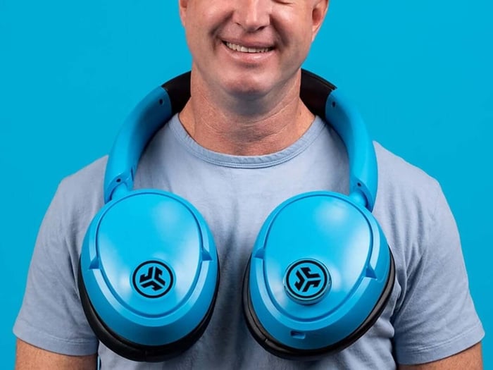 Blue XL headphones resting on table