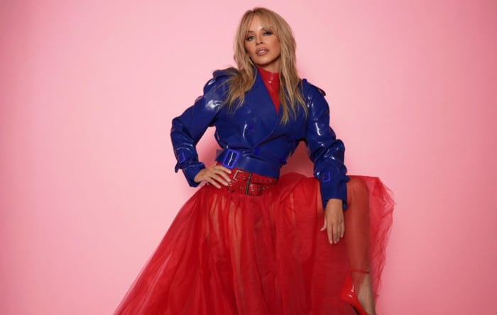 Kylie Minogue smiling during a photoshoot