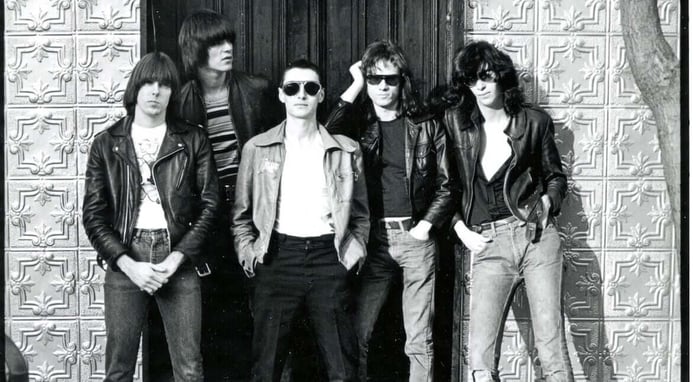 The Ramones pose with their art director and lighting designer Arturo Vega in New York, 1976.