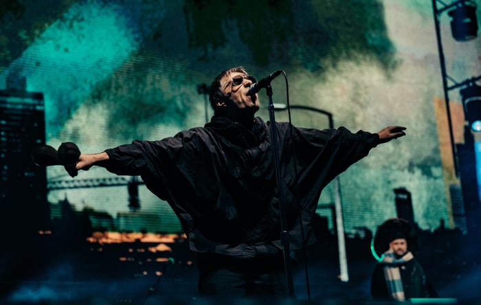 Liam Gallagher performing live on stage with Oasis