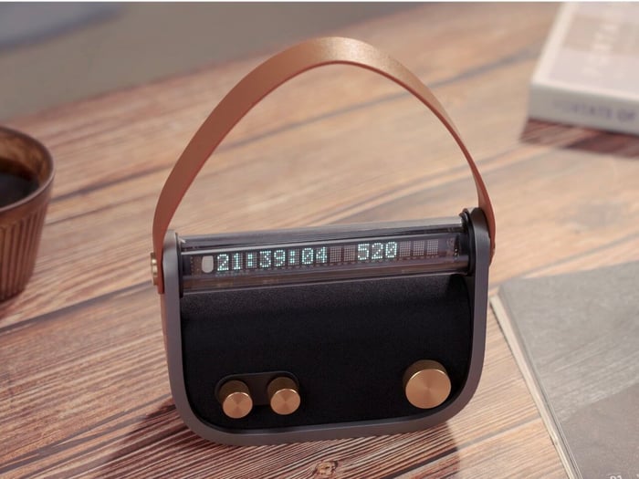 Luna Audio speaker handbag with fabric strap and brass accents