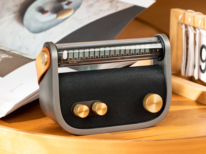Front close-up showing brass knobs and display