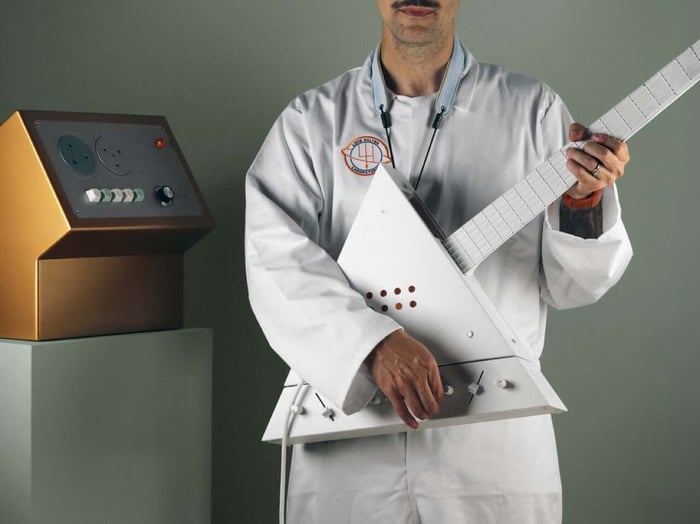 The modular trapezoidal base unit featuring effects pedals and the glowing crystal