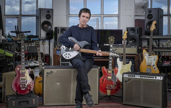 Johnny Marr in his studio surrounded by guitars