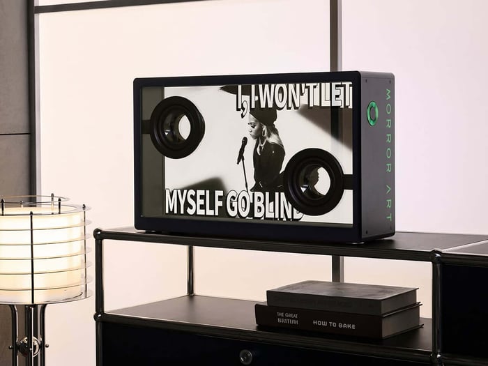 Close-up view of the transparent glass driver vibrating in sync with the music.