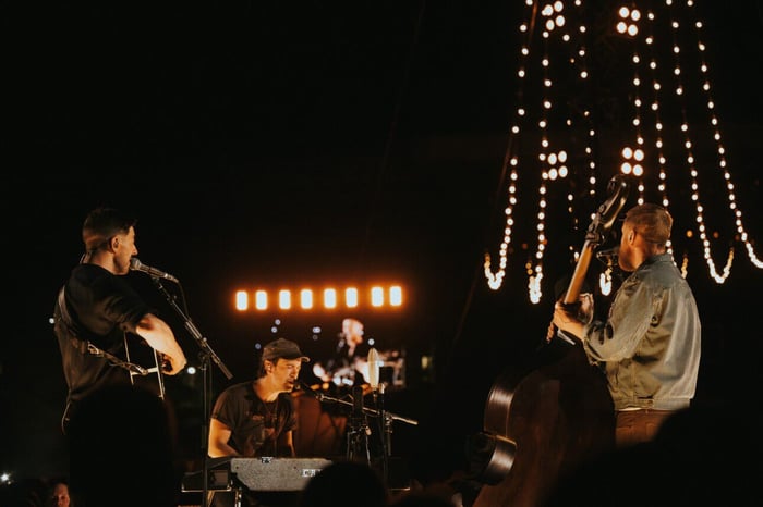 Mumford & Sons performing on b-stage at Folsom Field
