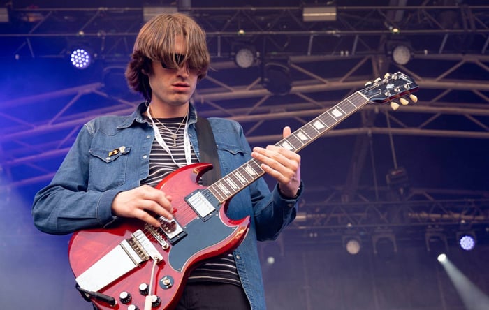 Callum Thompson of The Mysterines performing on guitar