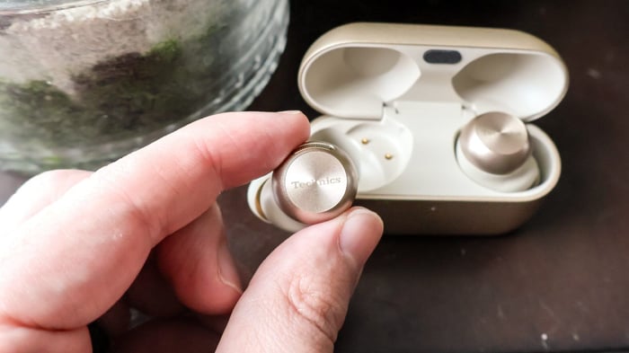 Technics EAH-AZ100 earbuds showcasing sleek design and Dolby Atmos support.