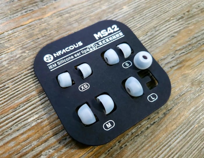 Silicone ear tips in black cardboard holder