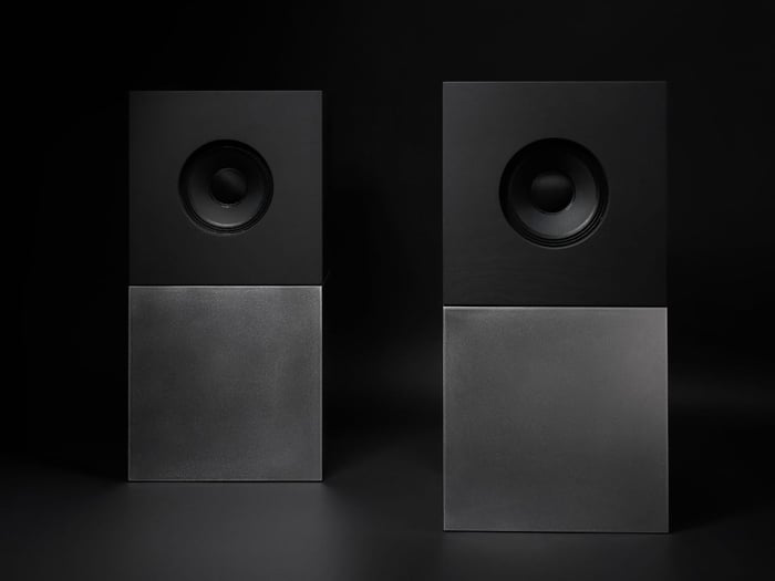 The Braque system featuring the matte black plywood upper cube stacked on a brushed steel base.