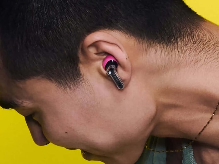 Yellow Ear (3a) earbuds displayed on a flat surface