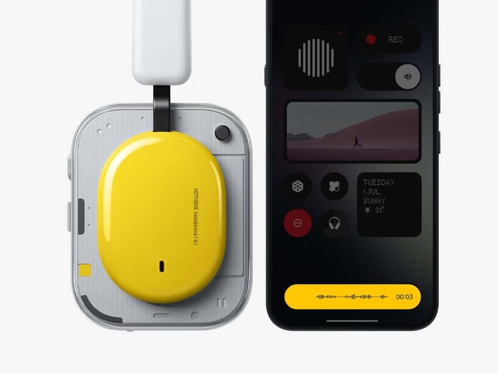 Ear cup close-up showing tactile control system