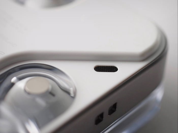 Nothing Ear (3) earbuds and case displayed with focus on transparent and metal elements