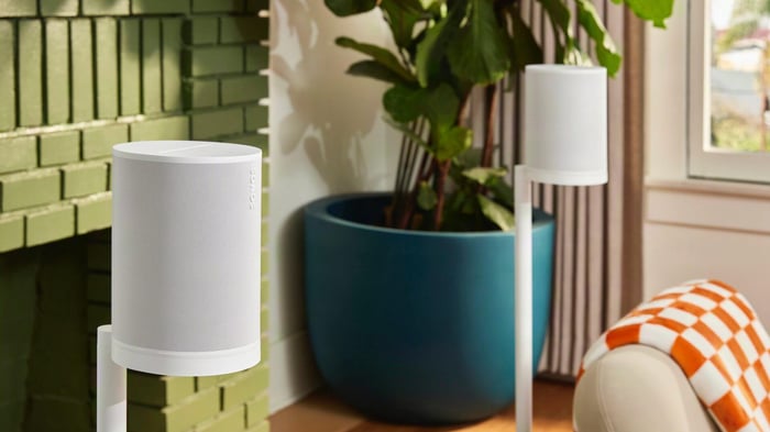 Two Sonos Era 100 SL speakers in a bright living room