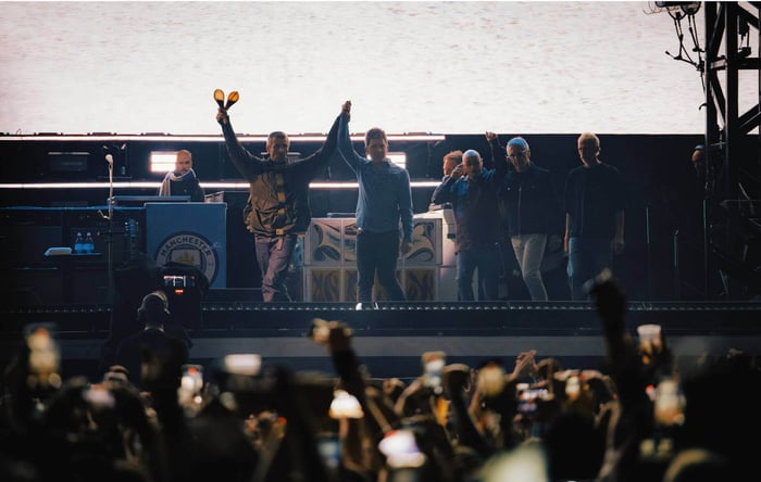 Noel and Liam Gallagher performing with Oasis at Cardiff Principality Stadium on July 4, 2025.