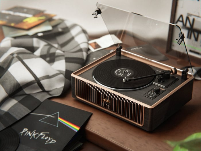 The PARON III vinyl player with a sleek black wood grain and metallic finish