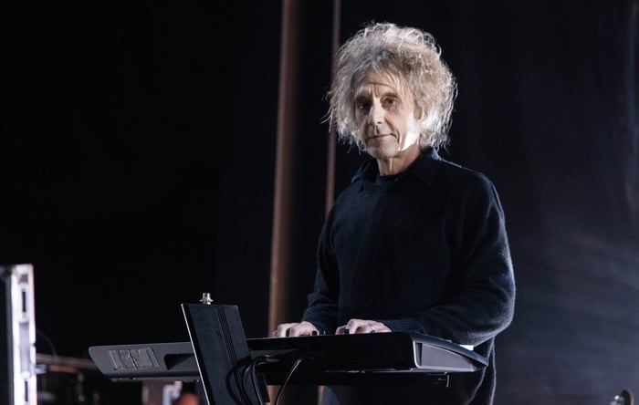 Perry Bamonte performing with The Cure