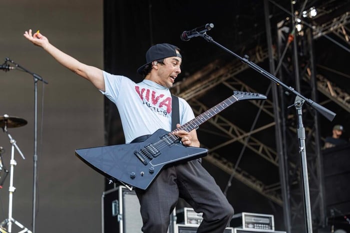 Vic Fuentes rocking the stage with Pierce the Veil