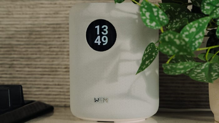WiiM Sound wireless speaker with cylindrical design and touchscreen