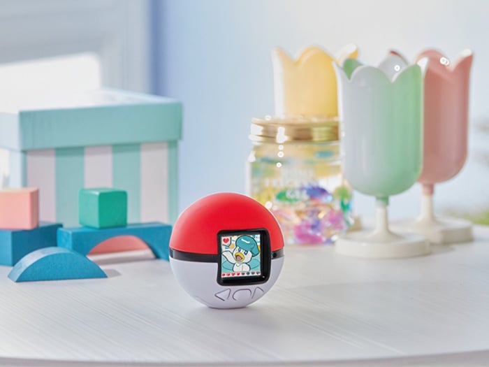 Interaction with the Pokémon Poke-Nade Monster Ball showing glowing LCD screen.